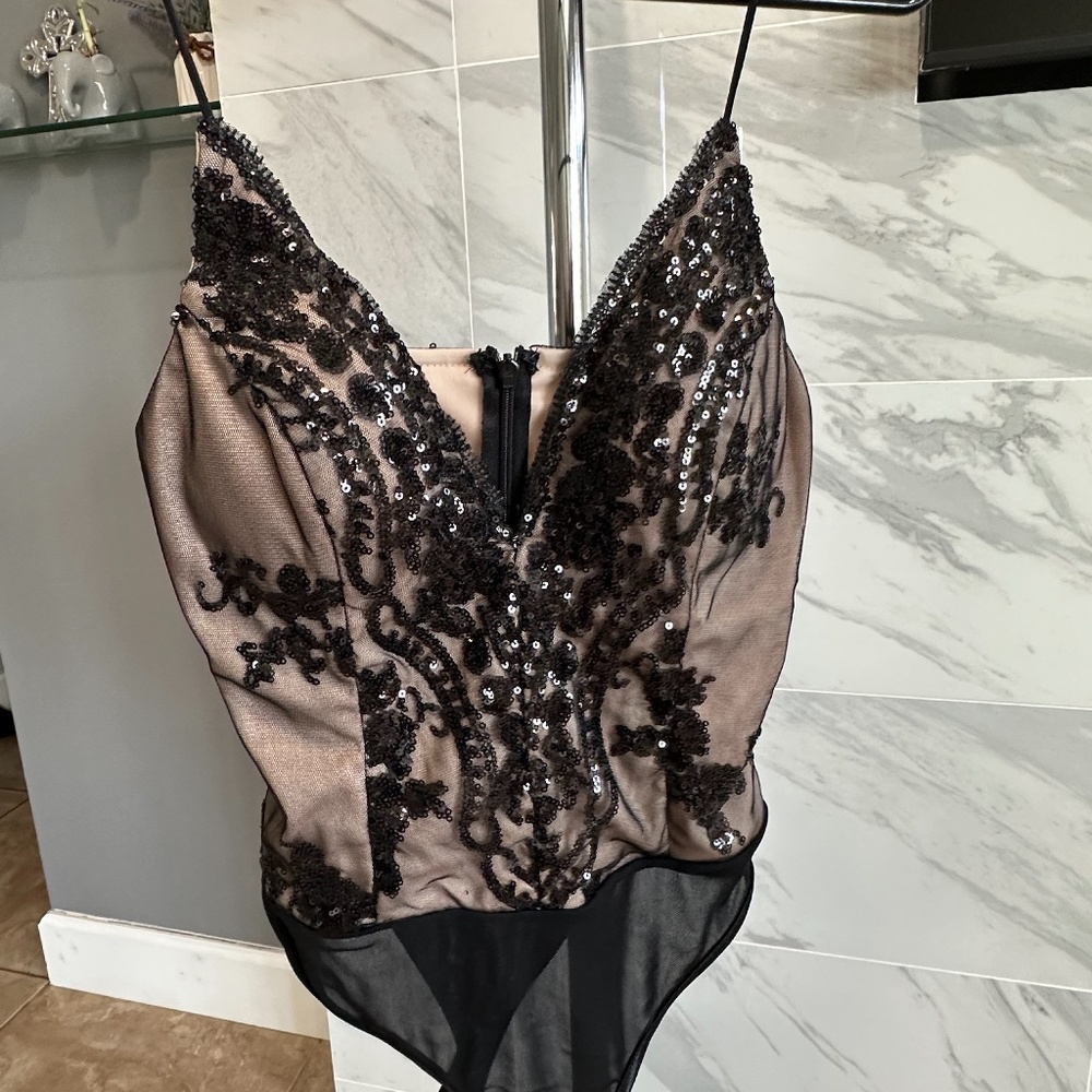 Party woman’s body suite  size small